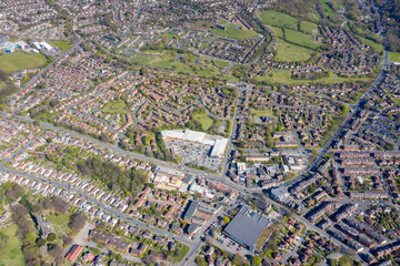 Aerial photo of the British town of Meanwood in Leeds West Yorkshire showing typical UK housing estates and rows of houses from above in the spring time on a sunny day