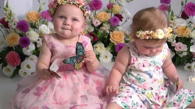 Slow Motion Cute twin sisters celebrating their 1th birthday.