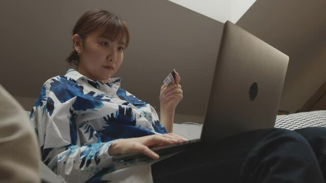Woman shooping over internet at home.