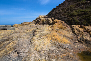 Fototapeta na wymiar Rocks at Tynemouth Beach, Northumberland, UK in May 2021