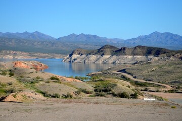 Lonely dirt road winding around Lake Mead at Echo Bay, Clark County Nevada.