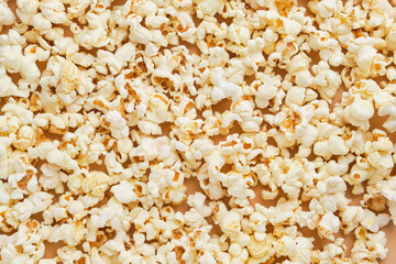Yellow movie style popcorn background, texture. Lot of popcorn