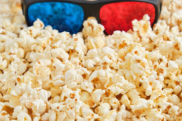 top view of 3d glasses on crunchy popcorn, cinema concept