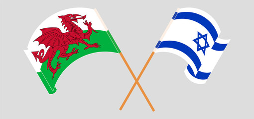 Crossed and waving flags of Wales and Israel