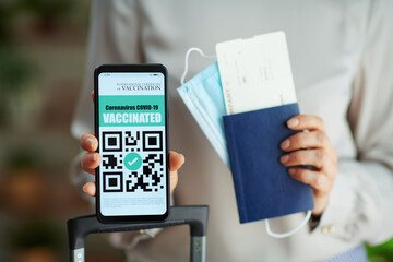 Closeup on young woman at modern home in sunny day
