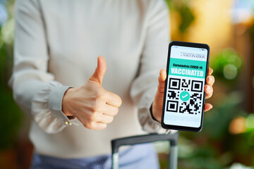 Closeup on young woman at modern home in sunny day