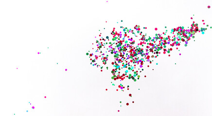 White background with multicolored glitter. Party background with confetti.