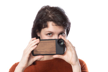 Female tourist or photographer doing mobile photography with a cell phone as an alternative...