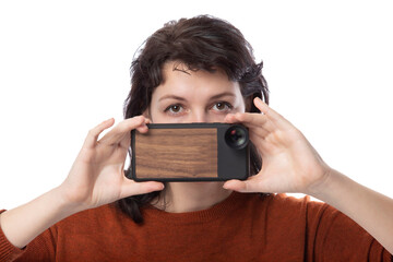 Female tourist or photographer doing mobile photography with a cell phone as an alternative...