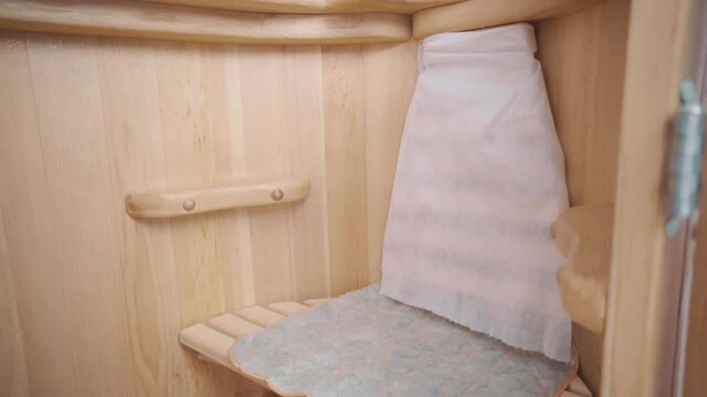 Closeup of cedar phyto barrel with locks on latches grates and handstands inside
