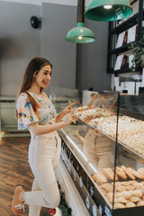 Young couple choosing at pastry counter