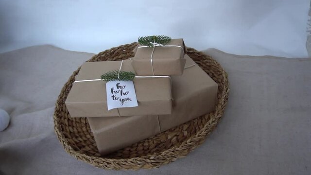 Slow Motion friendly gift wrapping craft paper fir branches, gift basket