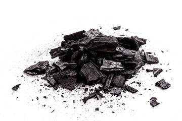 pile of charcoal, burnt pieces of coal, with space for text on white background