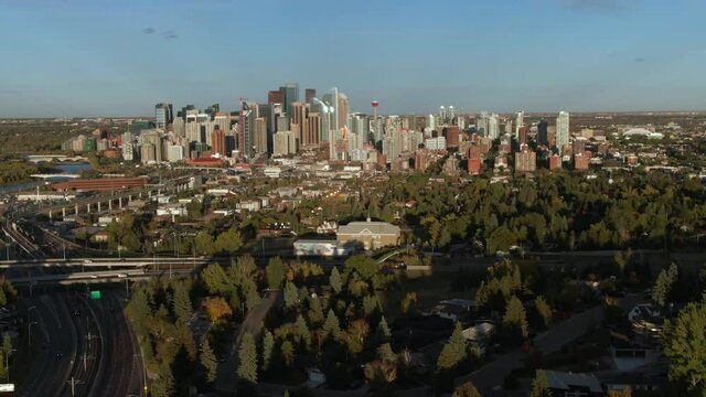 Aerial hyperlapse view of Calgary cityscape showing modern high rise buildings in the financial district during summer in Alberta, Canada.
