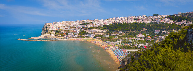 Panoramic view of Peschici with its golden beaches and rock formations, Gargano, Italy - obrazy, fototapety, plakaty