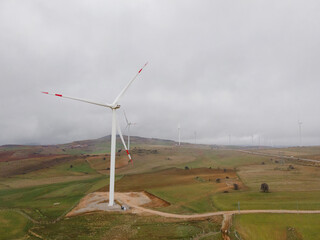 Fototapeta premium Electricity Wind turbine landscape. Wind farm energy eco friendly in mountains. Renewable clean energy production