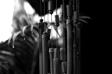 bamboo wind chimes and leafs - black and white