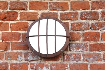 Modern Waterproof Wall Lamp On The Old Brickwall Closeup. Scone Lamp On Vintage Brick Wall At Nigh In Twilight. Facade Lighting