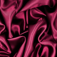 Smooth elegant pink silk or satin luxury cloth texture as abstract background. Luxurious background design