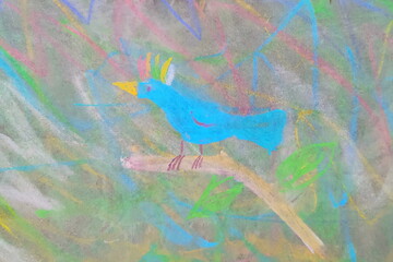 Drawing of a bright tropical blue bird, drawn by hand with crayons in a naive childish style