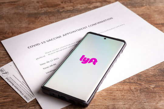 Clarksburg, MD, USA 05-12-2021: Biden administration announced an agreement that ride share apps  lyft and uber will offer free transportation to vaccination sites to increase COVID-19 vaccine rates