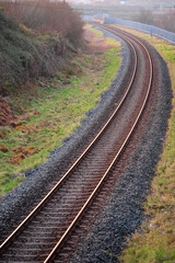 Rail road tracks in nature environment. Transport industry concept.