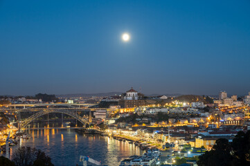 Fototapeta na wymiar Panoramic view on Douro river and old part of Porto city in Portugal at night