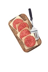 Minced Raw Steak Burgers from Beef Pork Meat on Cutting Board Isolated on White Background, Overhead View. Uncooked Ground Meat Patties for Grilling. Burgers for BBQ Grill and Spatula, Top View.