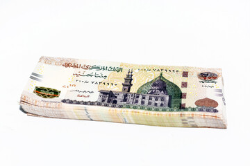 Stack of 200 Egyptian pounds banknote year 2020, obverse side has an image of Mosque of Qani-Bay Cairo, Egypt. The reverse side has an image of The Seated Scribe isolated on white background - obrazy, fototapety, plakaty