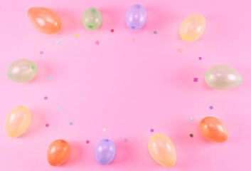 Balloons on a pink background.
