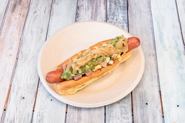 Hot dog with avocado, onion, ham and boiled egg