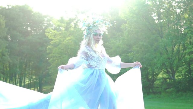 Slow Motion Fairy tale princess in light summer blue turquoise dress 