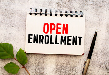 Open Enrollment - doctor holding chalkboard with text
