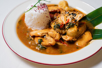 thighs in banana sauce with rice. Traditional Pan-Asian dish.
