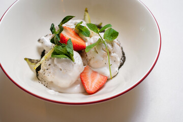 Homemade ice cream with strawberries and mint