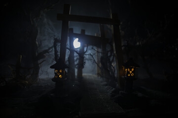 Plakat Creative artwork decoration. Abstract Japanese style wooden tunnel at night. Selective focus
