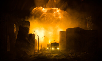 Empty street of burnt up city, flames on the ground and blasts with smoke in the distance....