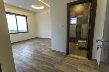 Room interior after renovation, unfurnished apartment with white walls and color pattern on the wall