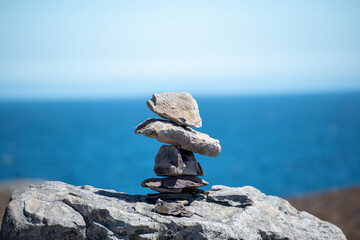 Inukshuk, a stack of granite rocks in the form of a person. The formation is a symbol of direction....