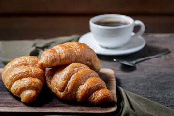 Croissants and coffee on the table in the morning