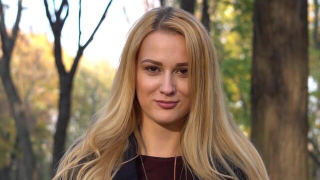 Slow Motion Attractive young woman in an autumn