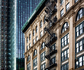 New York City apartment buildings with steel fire escape stairways in Soho