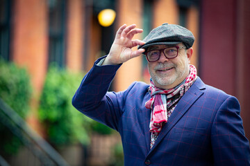 bohemian artist man in colorful clothes walking in the west village in New York - obrazy, fototapety, plakaty