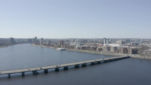 Fly over Charles River approaching Harvard Bridge against Boston skyline