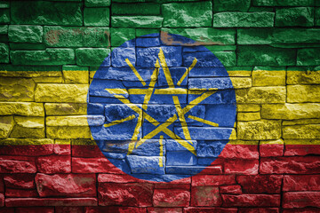 National flag of Ethiopia on stone  wall background.The concept of national pride and symbol of the...