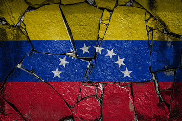 National flag of Venezuela depicting in paint colors on an old stone wall. Flag  banner on broken  wall background.