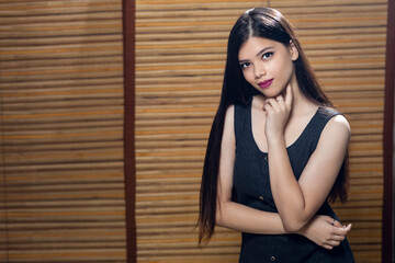 Fototapeta premium Portrait of an attractive Indian young female, fashion model for advertisement, hair flying for fashion look.