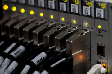 Network connection technology with broadband aggregation carrier electronic equipment, row of data cables and status LEDs to show working status of data center equipment in mobile telecommunications