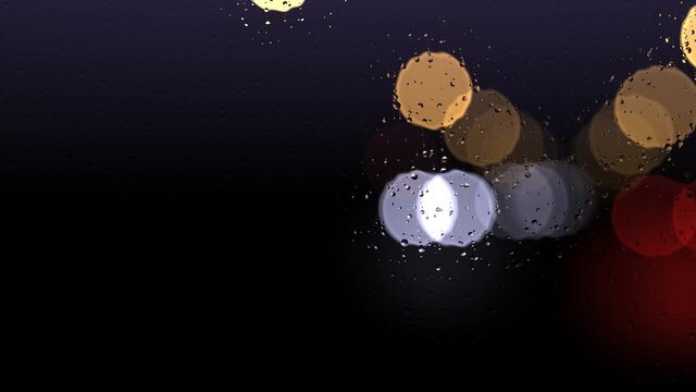 Water Drops Rolling Down Car Windscreen Window With Cars Passing Outside Night