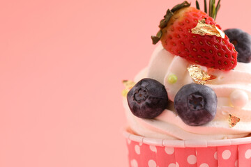 Fruits cupcake isolated in pink background
